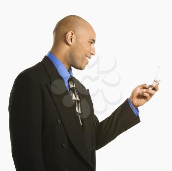 Royalty Free Photo of a Businessman Using a Cellphone
