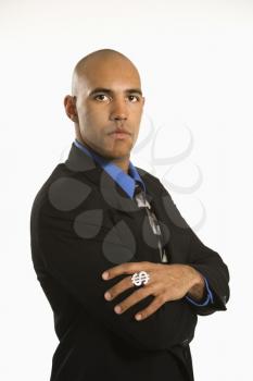Royalty Free Photo of a Man in a Suit Wearing a Ring With a Money Sign
