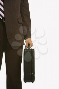 African American businessman in suit holding briefcase.