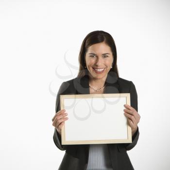 Royalty Free Photo of a Businesswoman Holding a Sign Smiling