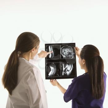 Royalty Free Photo of Female Doctors Analyzing an X-ray
