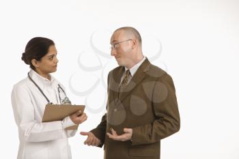 Royalty Free Photo of a Doctor Talking With a Businessman