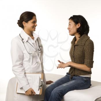 Royalty Free Photo of a Doctor Talking to a Patient