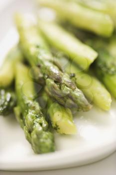 Royalty Free Photo of a Plate of Green Cooked Asparagus