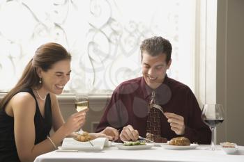 Royalty Free Photo of a Couple Eating Dinner in a Restaurant