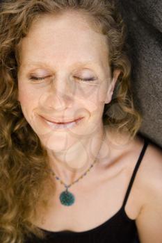 Royalty Free Photo of a Woman Smiling With Eyes Closed