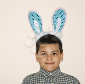Royalty Free Photo of a Little Boy Wearing Bunny Ears
