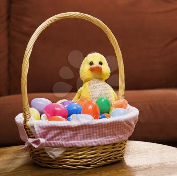 Royalty Free Photo of an Easter Basket Holding Eggs and a Duck