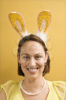 Royalty Free Photo of a Woman Wearing Rabbit Ears