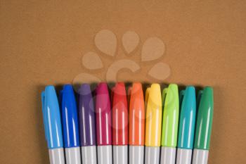 Royalty Free Photo of a Group of Colorful Markers Lined Up in a Row