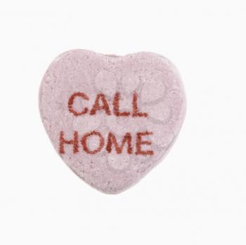 Royalty Free Photo of a Purple Candy Heart That Reads Call Home