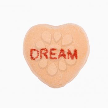 Royalty Free Photo of an Orange Candy Heart That Reads Dream