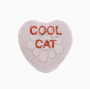 Royalty Free Photo of a Purple Candy Heart That Reads Cool Cat