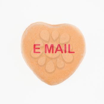 Royalty Free Photo of an Orange Candy Heart That Reads Email
