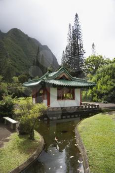 Royalty Free Photo of a Pagoda With a Stream in Iao Valley State Park in Maui, Hawaii