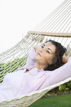Royalty Free Photo of a Woman Lying in a Hammock Relaxing
