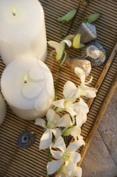 Royalty Free Photo of an Above View of Lit Candles on a Tray With White Orchid Flowers