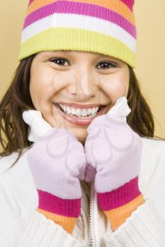 Royalty Free Photo of a Woman Wearing a Hat and Mittens