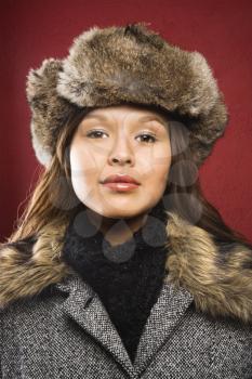 Royalty Free Photo of a Woman Wearing a Fur Hat 