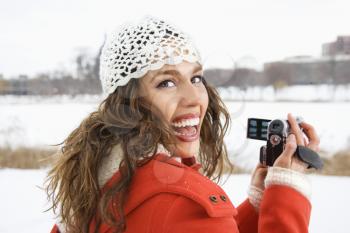 Royalty Free Photo of a Woman Holding a Video Camera