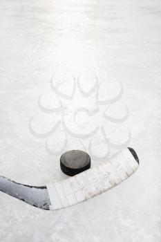 Royalty Free Photo of a Hockey Stick on an Ice Rink 