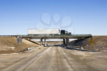 Royalty Free Photo of a Tractor Trailer Truck on an Overpass