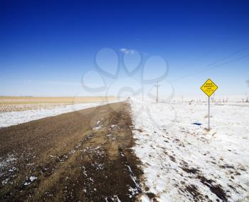 Royalty Free Photo of a Snowy Dirt Road 