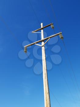 Royalty Free Photo of Power Lines Against a Blue Sky