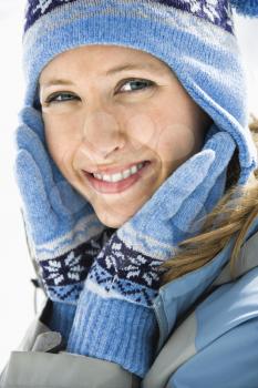 Royalty Free Photo of a Smiling Blond Woman Wearing a Blue Ski Cap