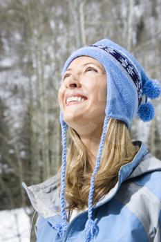 Royalty Free Photo of a Woman Wearing a Blue Ski Cap Smiling