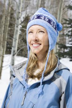 Royalty Free Photo of a Blonde Woman Smiling Outside in the Snow