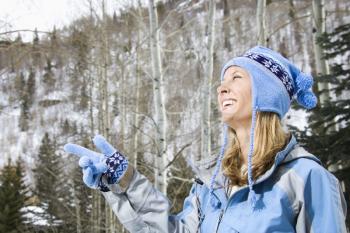 Royalty Free Photo of a Smiling Woman Wearing Blue Winter Clothing