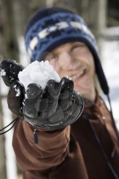 Royalty Free Photo of a Teenager Holding a Snowball