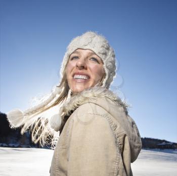 Young adult Caucasian woman outdoors in winter attire.