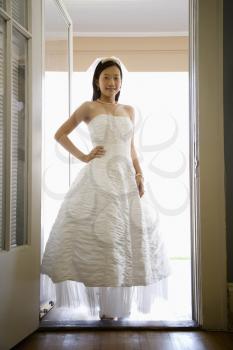 Royalty Free Photo of a Bride Standing in a Doorway