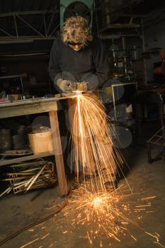 Royalty Free Photo of a Metal Smith Working