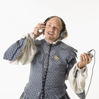 Royalty Free Photo of William Shakespeare in Period Clothing Listening to an MP3 Player Smiling