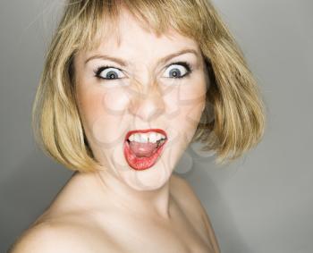 Royalty Free Photo of a Blonde Woman With an Angry Expression