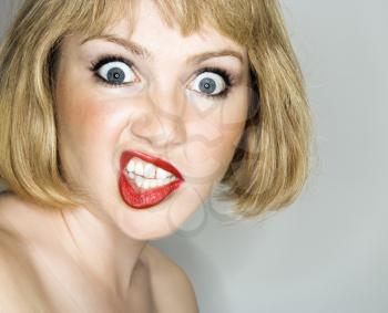Royalty Free Photo of a Blonde Woman With an Angry Expression