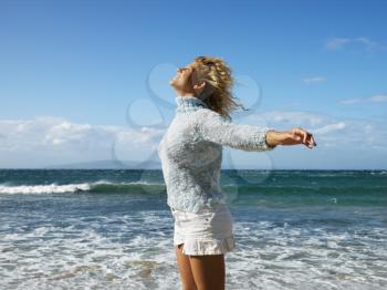 Royalty Free Photo of a Pretty Blond Woman on Maui, Hawaii Beach Smiling