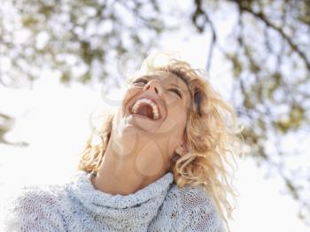 Royalty Free Photo of a Pretty Blond Woman in Maui, Hawaii Laughing