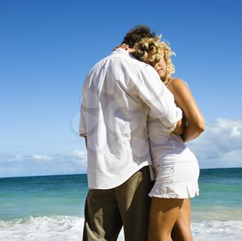 Royalty Free Photo of an Attractive Couple in a Sensual Embrace on Maui, Hawaii Beach