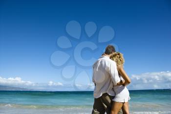 Royalty Free Photo of an Attractive couple in embrace on Maui, Hawaii beach