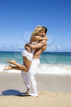 Royalty Free Photo of a Couple in Emotional Embrace on Maui, Hawaii Beach