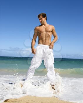 Royalty Free Photo of a Handsome Man Standing on Maui, Hawaii Beach