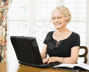 Royalty Free Photo of an Older Woman Using a Laptop