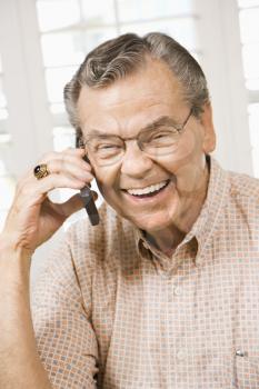 Royalty Free Photo of an Elderly Man Talking on a Cellphone