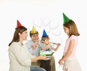 Royalty Free Photo of a Family Celebrating a Little Girl's Birthday
