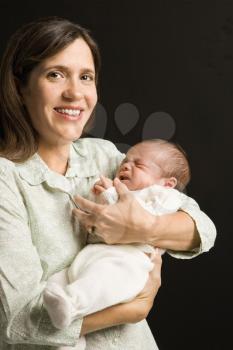 Royalty Free Photo of a Mother Holding Her Baby