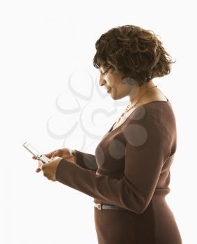 Royalty Free Photo of a Woman Pushing Buttons on a Cellphone